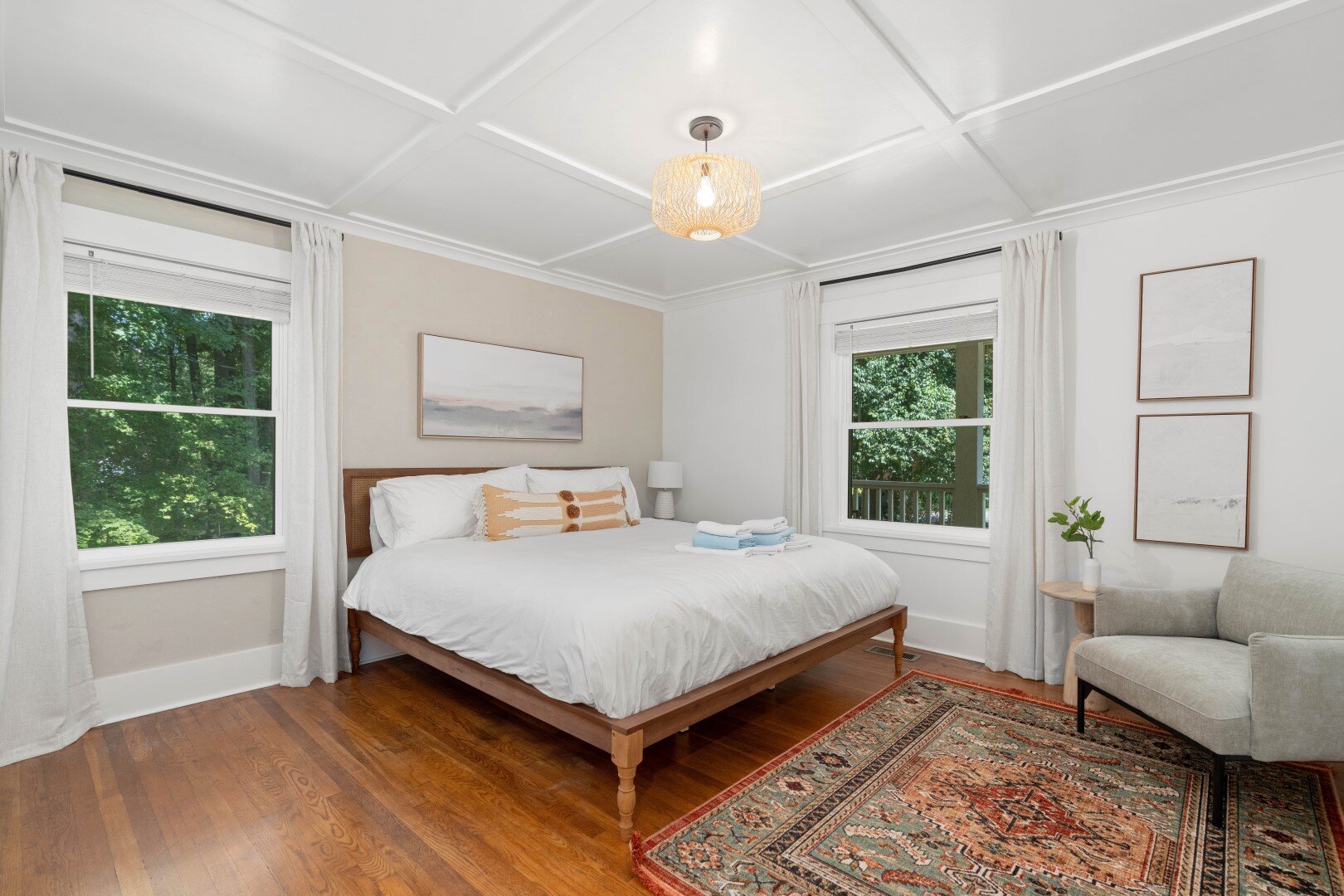 Primary bedroom with coffered ceiling